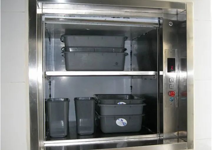 A modern dumbwaiter service lift  showcasing its shelves and compact design