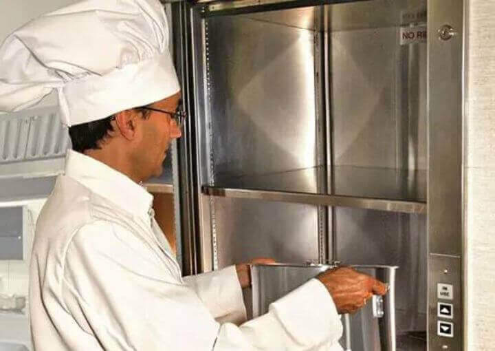 Chef arranging food in the commercial elevator of Royal Fuji