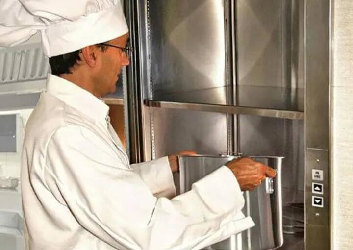 Chef arranging food in the Restaurant Dumbwaiter of Royal Fuji.