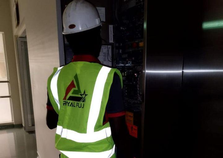 Dedicated Royal Fuji Staff Conducting Regular Maintenance for Passenger Lift Safety.