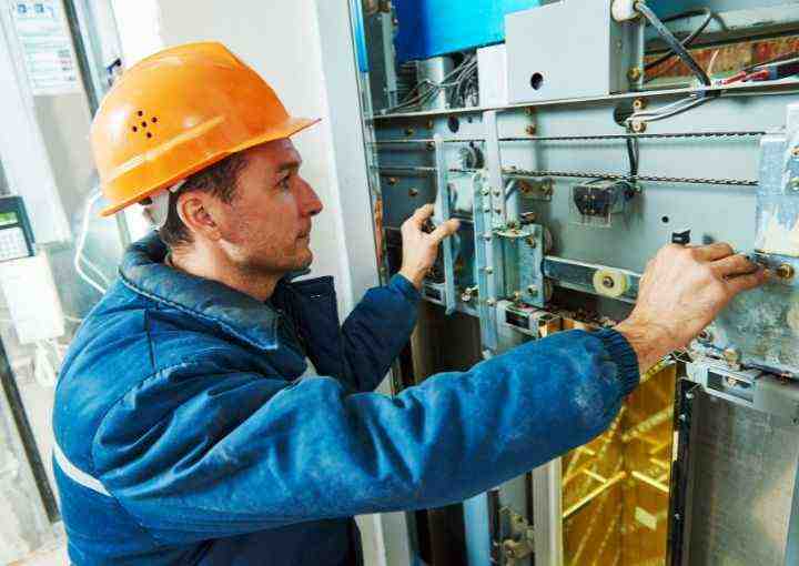Skillful Royal Fuji Staff Conducting Repair Service, ensuring efficient elevator restoration.