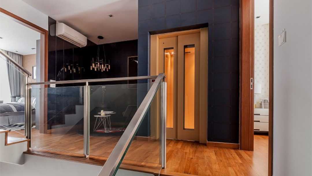 A sleek and modern residential lift in a Dubai home, showcasing advanced design and safety features.