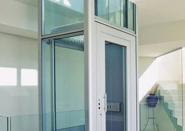 Modern traction home elevator in a residential setting, offering smooth and efficient vertical transportation.